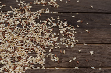 Brown rice on wooden backgroung 