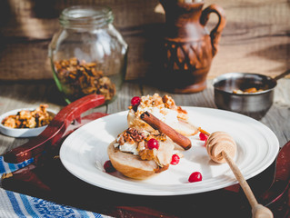 Baked pears with ricotta, walnuts, honey and cranberries