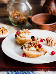 Baked pears with ricotta, walnuts, honey and cranberries