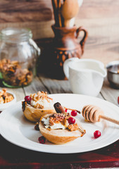 Baked pears with ricotta, walnuts, honey and cranberries,tinting