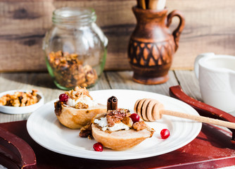 Baked pears with ricotta, walnuts, honey and cranberries