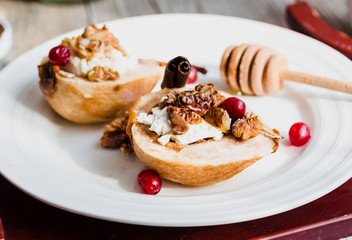 Baked pears with ricotta, walnuts, honey and cranberries