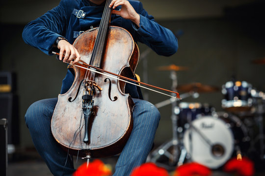 Symphony concert, a man playing the cello