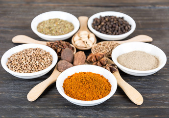 Spices and herbs in  bowls.