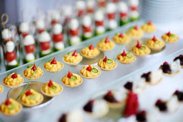 Plates with assorted snacks on an event party