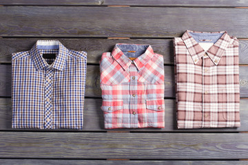 Three stylish men's checkered shirts. - 95487460