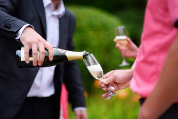 Pouring champagne into a glass