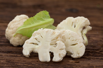 Cauliflower pieces on wooden rustic table