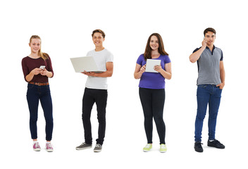 Obraz premium Studio Shot Of Teenagers Using Communication Technology