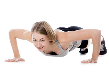 Fototapeta na wymiar Sporty woman doing push-ups