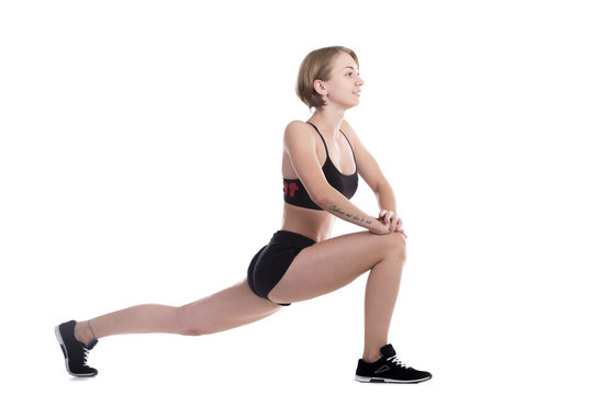 Sporty woman doing high lunges