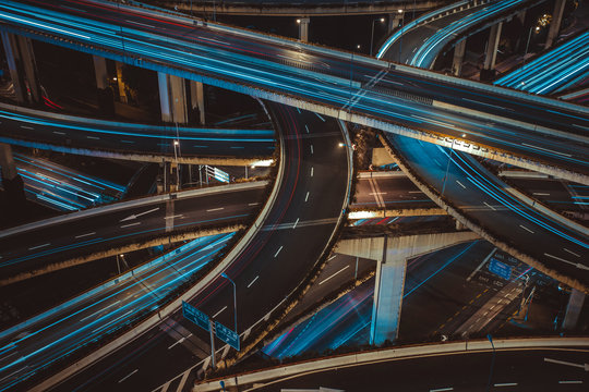 Modern city traffic road at night. Transport junction.