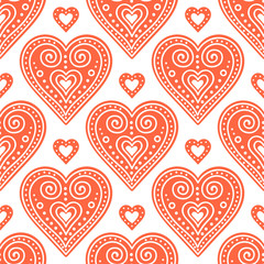 Fototapeta na wymiar Pattern with gingerbread hearts. Cute Christmas background with hand drawn cookies. Seamless winter pattern. Brown colors.