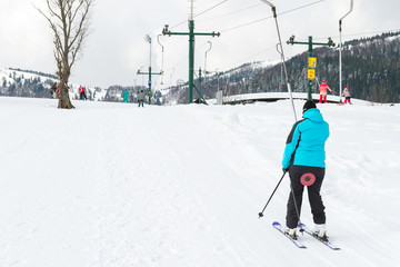 Winter sports, skier using ski lift