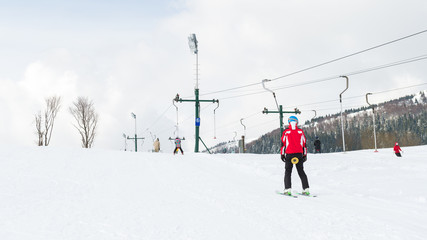 Fototapeta na wymiar Winter sports, skier using ski lift