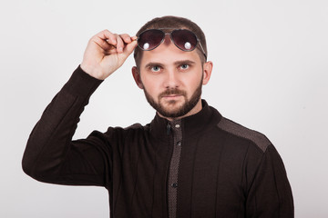 Fototapeta premium a man on a white background in a brown jacket with glasses
