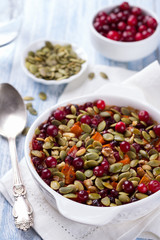 Millet pumpkin gratin with cranberries, walnuts and pumpkin seeds