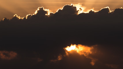 Sun behind cloud