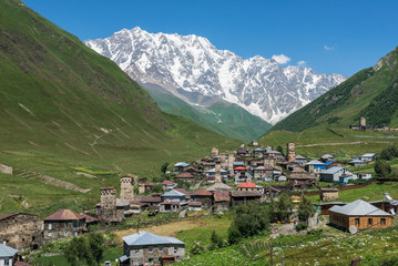 Fototapeta na wymiar villages community called Ushguli in Upper Svanetia region, Georgia. Shkhara mountain on background