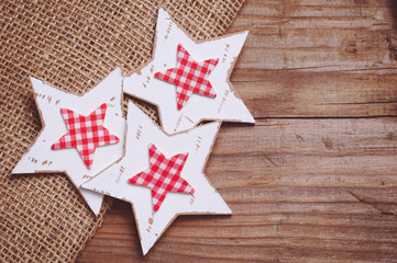 Stars shaped Christmas decoration on wooden background