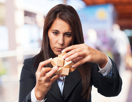 cool business-woman with puzzle cube