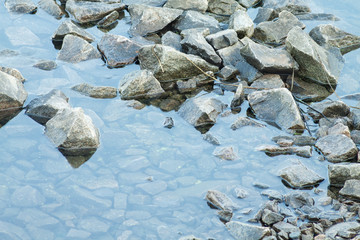 Fototapeta na wymiar Crushed stone in a river