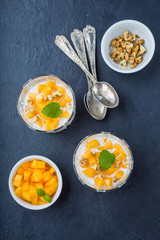 Pure semolina pudding with fresh mango and mint leaves