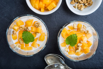 Pure semolina pudding with fresh mango and mint leaves