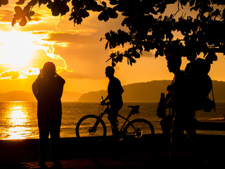 Fototapeta na wymiar People at Sunset on the beach of Ao Nang in Krabi