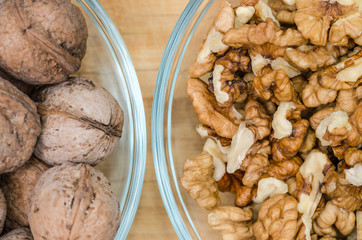 Raw walnuts in shell and peeled. Oleaginous