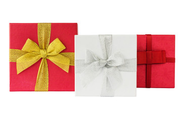 Three white and red gift boxes with ribbon isolated over white background