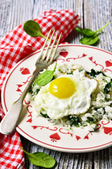 Rice with spinach and fried egg.