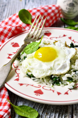 Rice with spinach and fried egg.