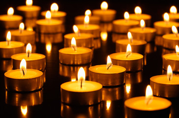 Many burning candles with shallow depth of field
