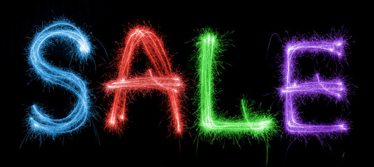 Sparkling inscription of SALE on a black