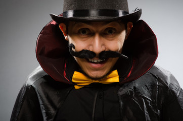 Funny magician man wearing tophat