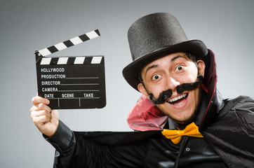Funny man with movie clapboard