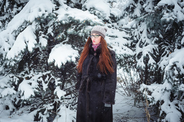 Winnter girl and snow fir tree.