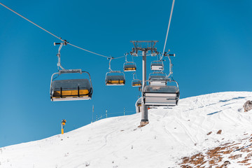 Ski lifts durings bright winter day