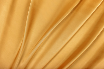 Fototapeta na wymiar Golden silk satin. 