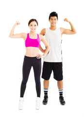 young fitness couple standing together isolated on white