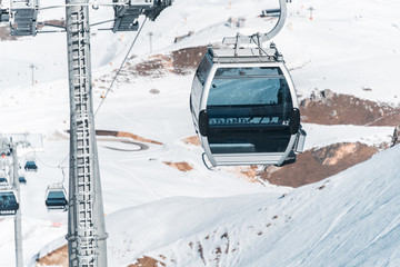 Ski lifts durings bright winter day