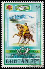 Stamp printed in Bhutan shows man on a horse