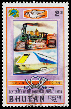 Stamp printed in Bhutan shows old and modern railway
