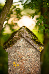 Stone fence and blurred forest background