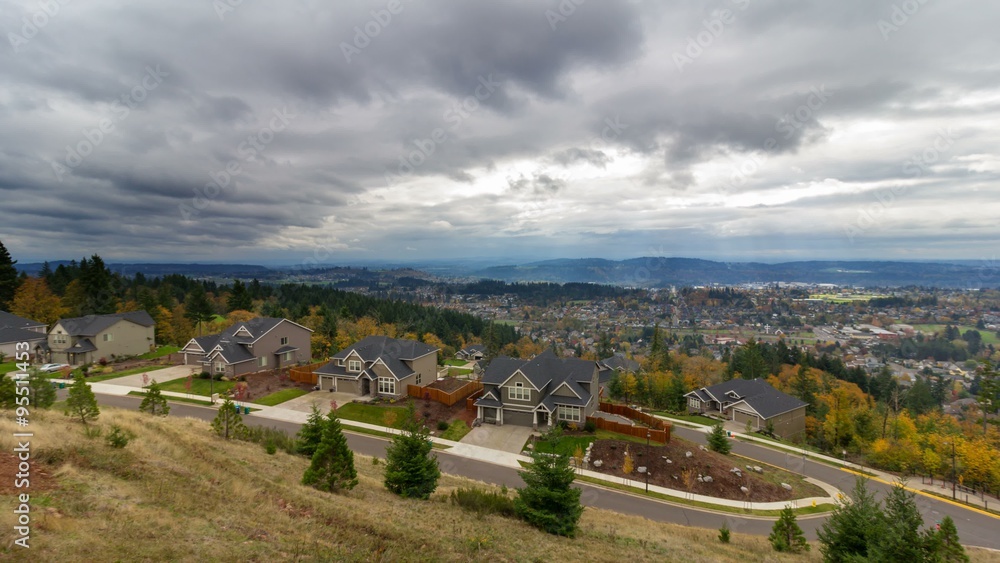 Wall mural uhd 4k time lapse of stormy clouds and sky over residential homes in happy valley oregon in colorful