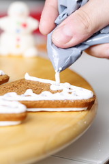 Decorating gingerbread cookies.