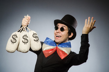 Funny man with money dollar sacks