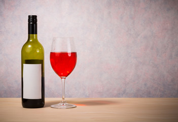 bottle and glass of red wine