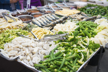 chili with blanching vegetables in the market
